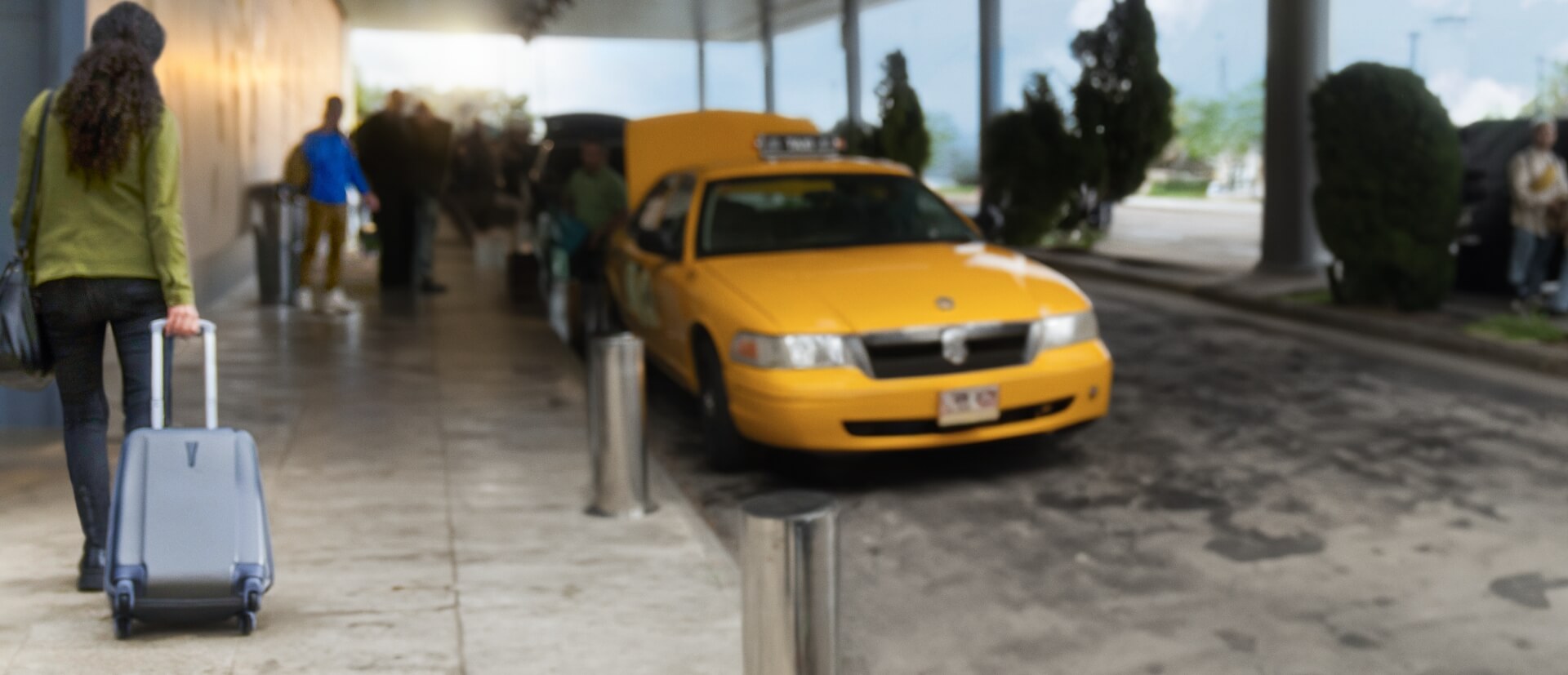 ERLEADA® (apalutamide) patient at the airport with luggage in hand